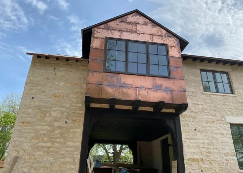 Copper metal panel facade on a stone building for Skylight Installation in Millersville